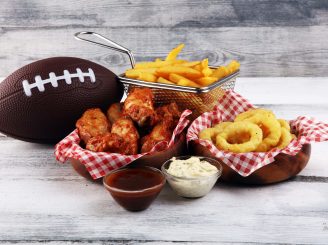 Chicken,Wings,,Fries,And,Onion,Rings,For,Football,On,A